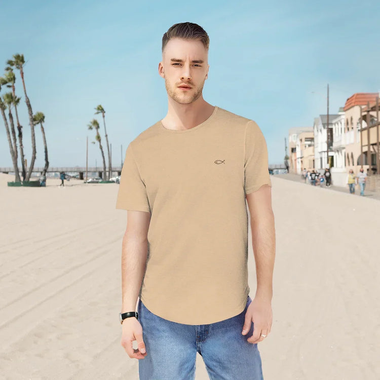 Man wearing beige Christian fish symbol t-shirt on a sunny beach street