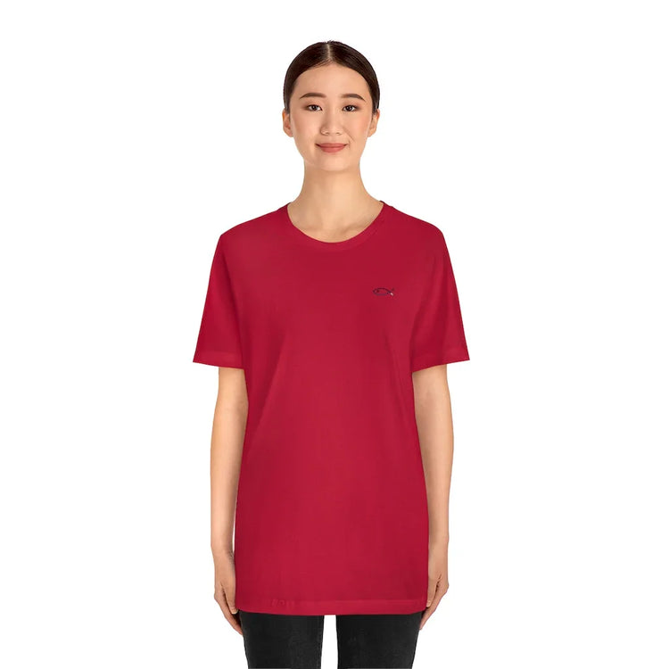 Woman wearing red Christian t-shirt with small fish symbol, plain white background