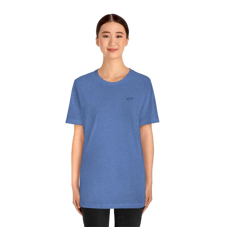 Woman wearing blue Christian t-shirt with small fish symbol on chest, faith-inspired apparel